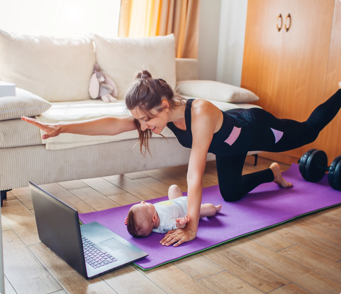 Mother doing yoga near baby