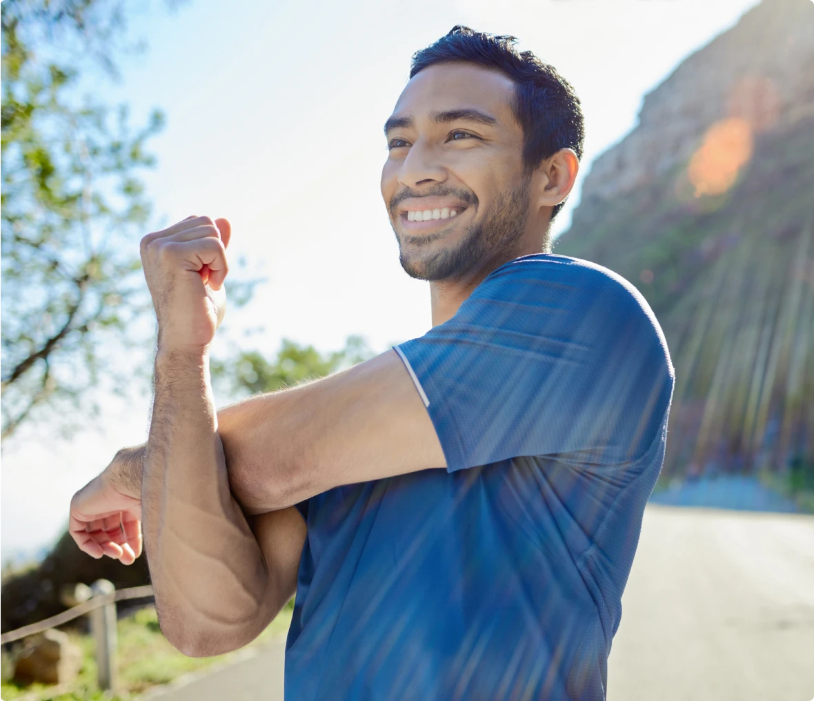 Smiling man exercising on a sunny day