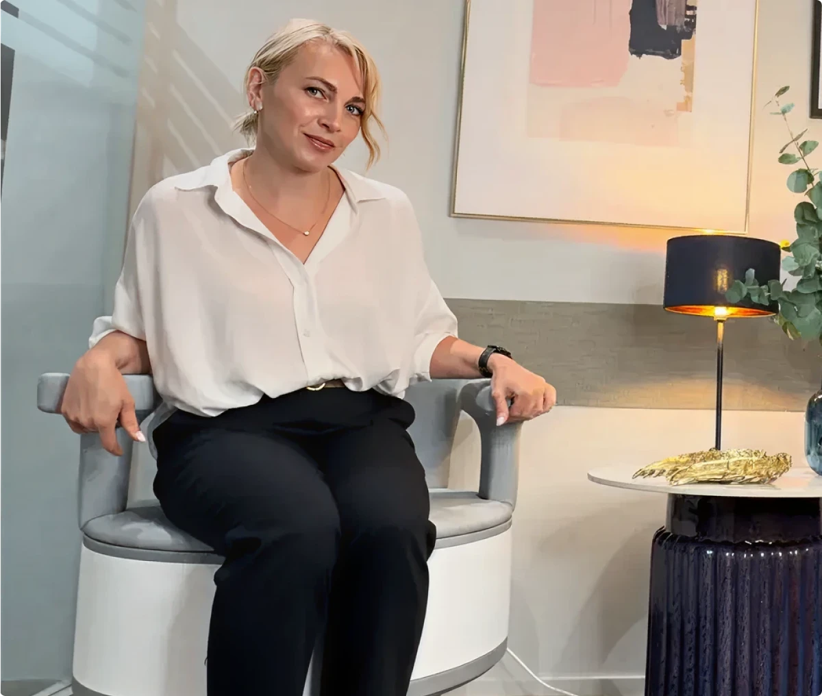 Person seated in modern interior
