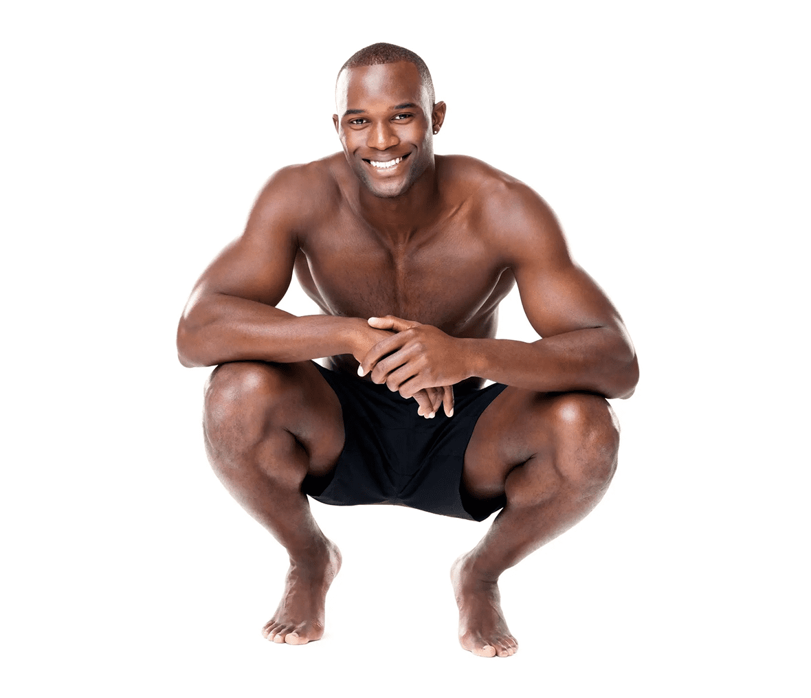 Smiling shirtless athletic man squatting barefoot