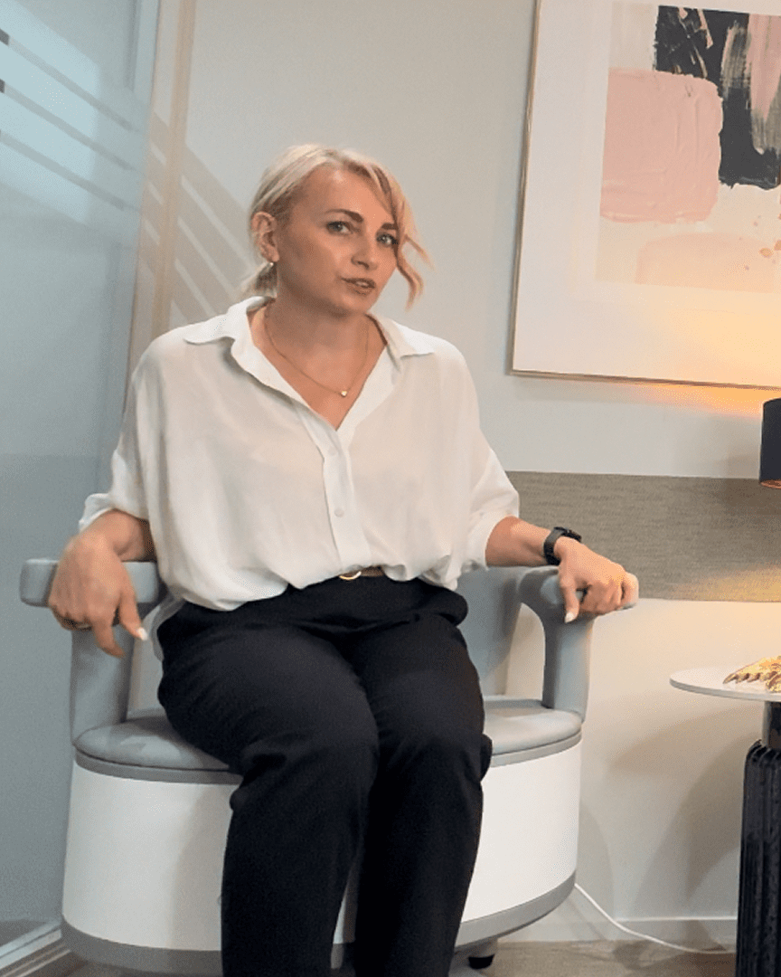 Professional woman seated in office chair