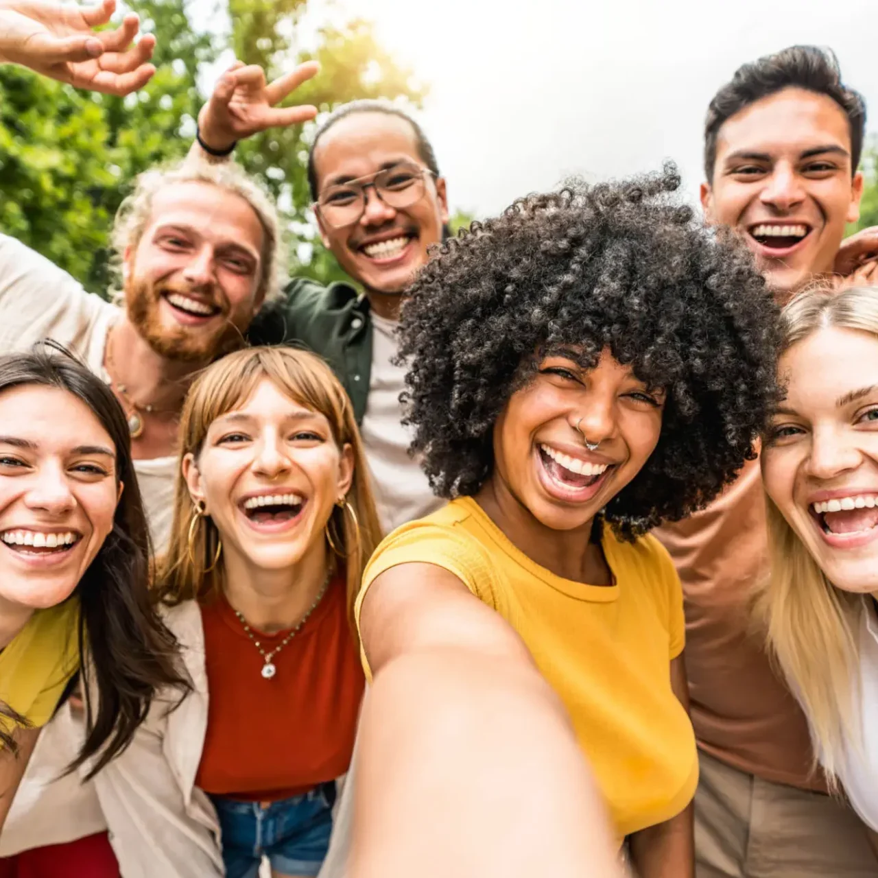 Group of friends smiling for selfie